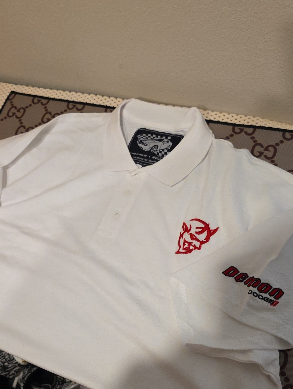 Reason White Polo with Red Devil Emblem